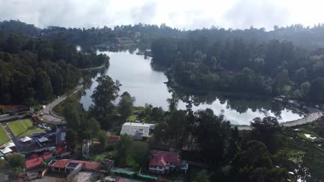 panoramic drone view of kodaikanal lake and the surrounding kodaikanal town, tamil nadu, india