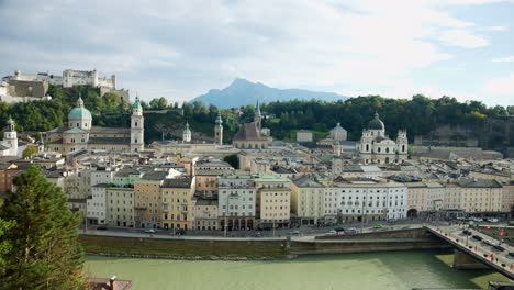 High-angle-looking-down-over-european-white-buildings-and-road-along-canal