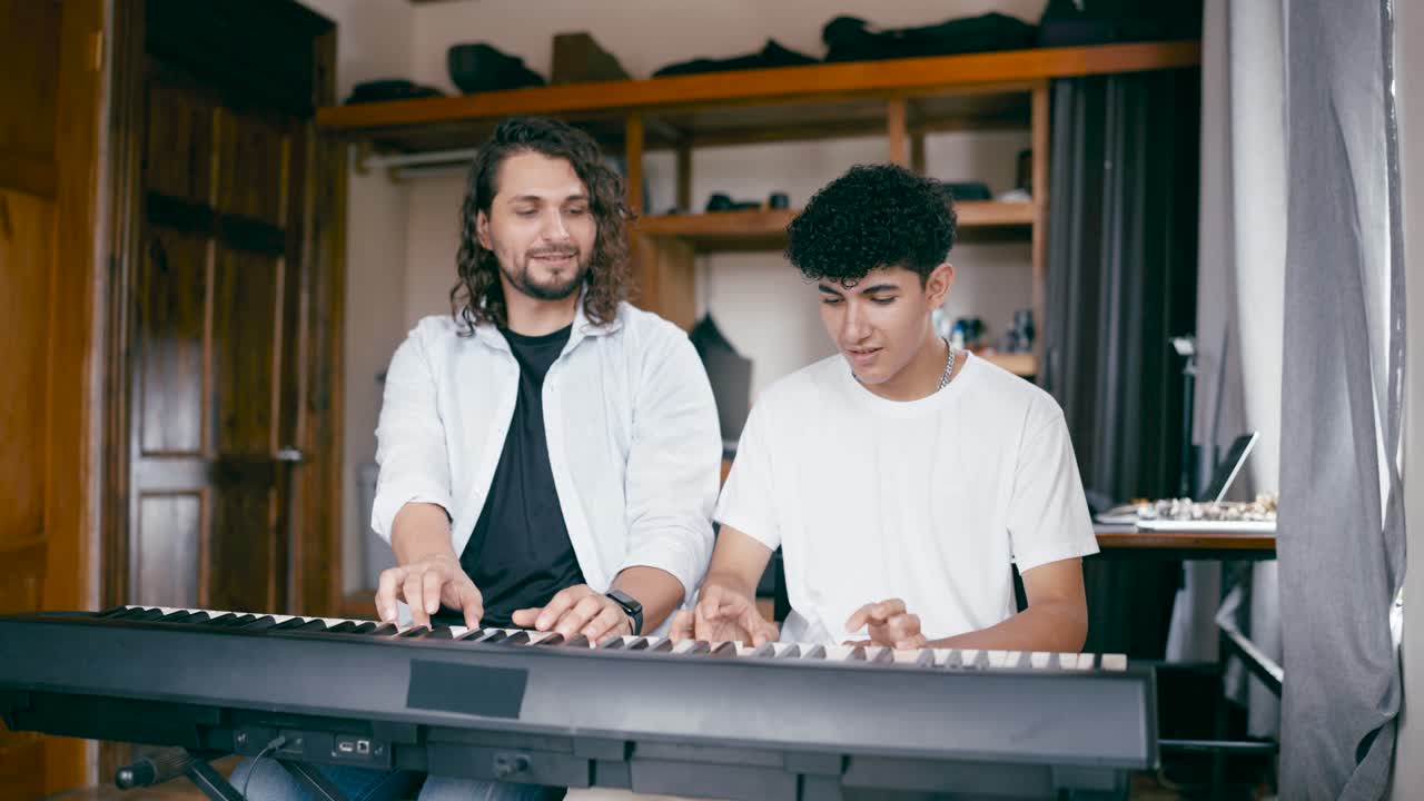 Two Young Musicians Playing Piano Together