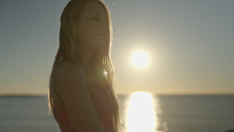 woman at sunrise by the sea