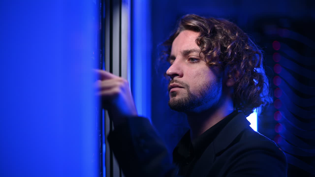 Man analysing servers in a data center