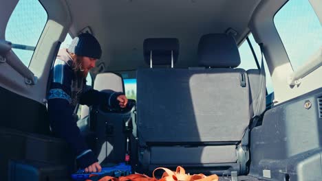 a man is dismantling the car’s interior in preparation for a pajero transformation - close up