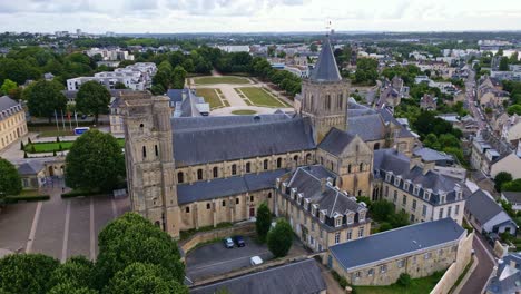 receding aerial movement from the ladies abbey of sainte-trinité with michel d'ornano park, caen, france