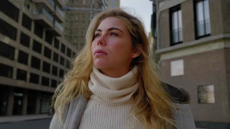 Close-up-of-serious-young-woman-looking-into-the-distance