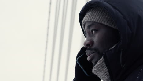 young person talking on the phone outdoors