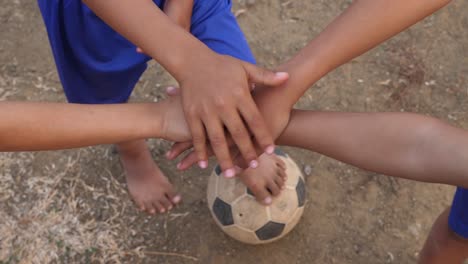 children playing soccer and showing teamwork
