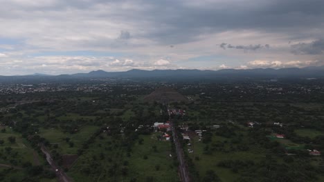 drone shot of pyramid of the sun on a cloudy and rainy day in teotihuacan, mexico