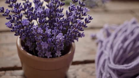 lavender and purple yarn on wooden table