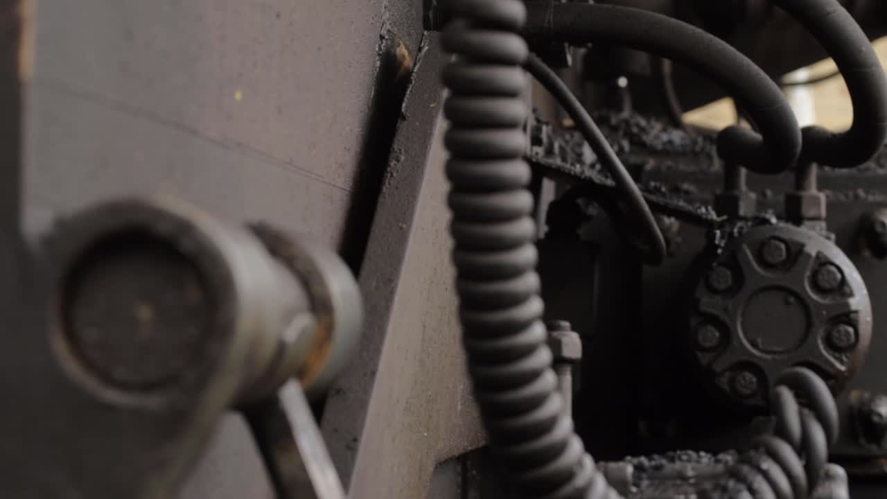 Industrial plant machinery engine motor close up panning shot