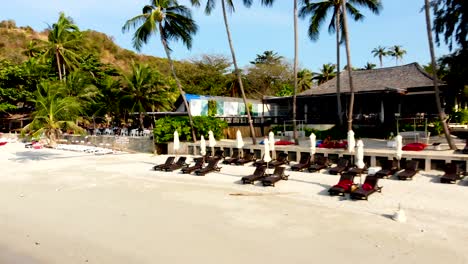 Retreating-drone-shot-of-Thongson-Bay-beachfront,-revealing-the-luxurious-resorts-by-the-sea,-facing-the-Gulf-of-Thailand,-in-Koh-Samui,-Surat-Thani-province-in-Thailand