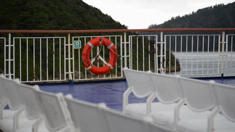 static view from top deck of ferry riding along the lush mountains of the northern fiords on new zealand's south island