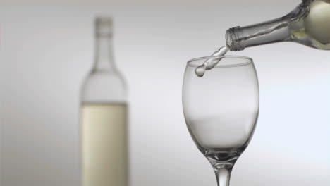 Bottle-pouring-in-super-slow-motion-white-wine