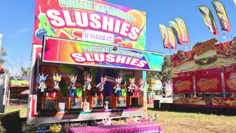 vibrant slushie stand at outdoor fair