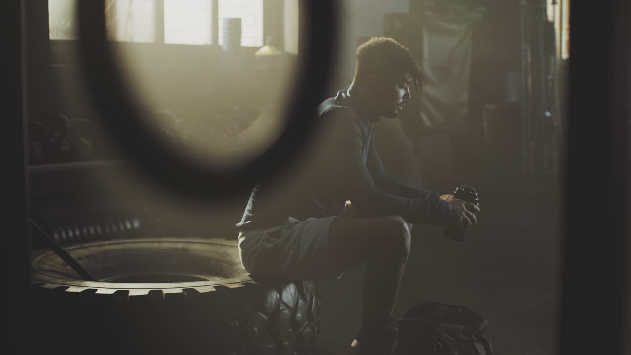 Man resting in gym after workout