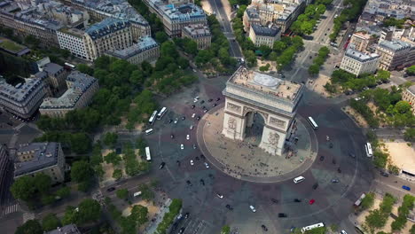 beautiful aerial shot slowly rotating around arc de triomphe in paris, france