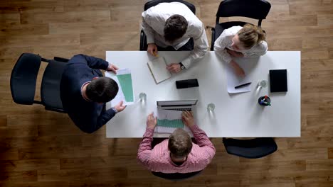 angry boss coming in and screaming at business team, topshot, giving documents with results to colleagues, irritated and raged