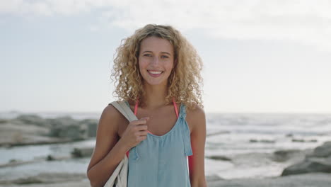 portrait of young beautiful blonde woman smiling confident on beach relaxed