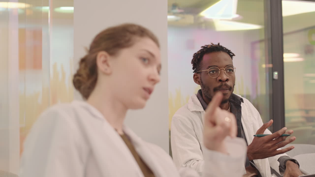 Medical Students Chatting during Lecture