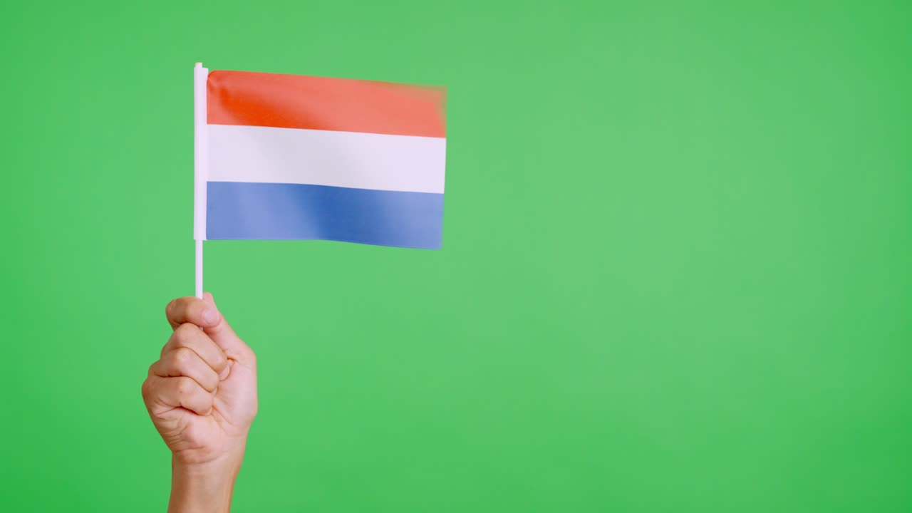 Wind waving a dutch pennant holding by a person