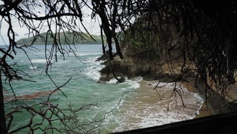 shoreline view from inside an abandoned concrete house in tobago