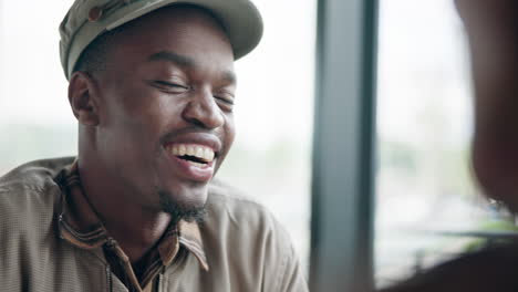 Happy,-laugh-and-black-man-in-cafe-with-friend