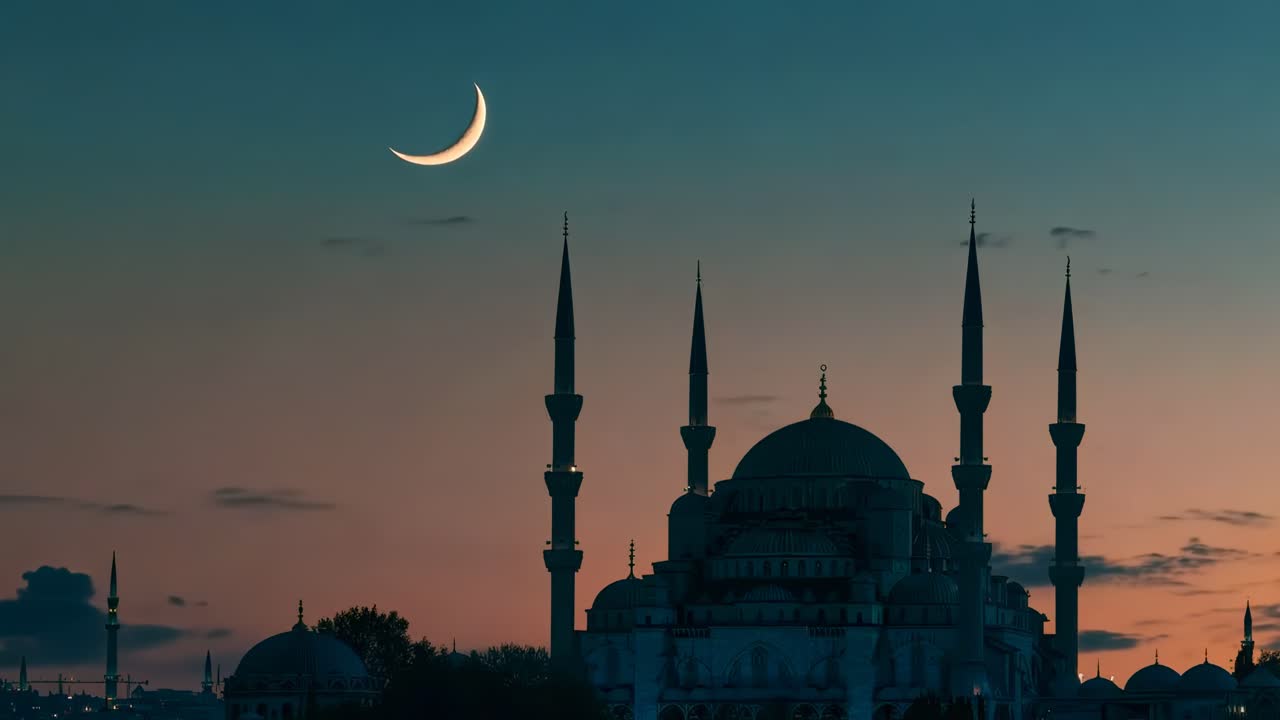 A serene video still of a mosque at dusk, captured from a low angle