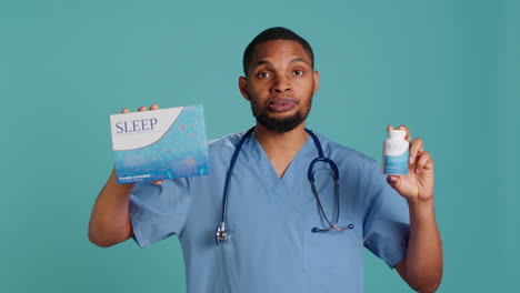 Portrait-of-male-nurse-holding-sleep-deprivation-medicine