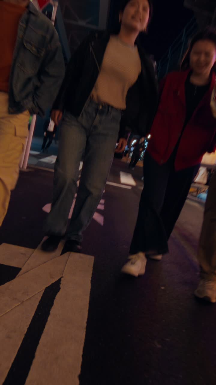 Friends Walking Through a Night Market