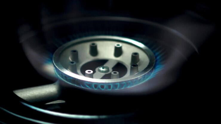 Gas Stove Burner Igniting with Blue Flame