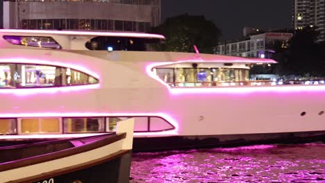 luxury boat with passengers cruising on a river