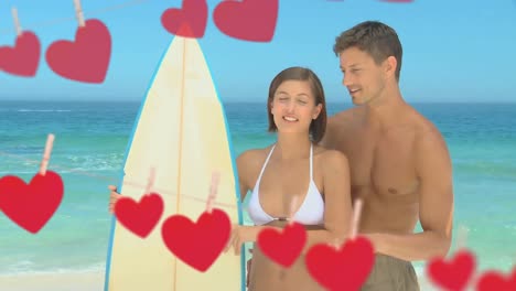 surfer couple at the beach together during vacation for valentine day