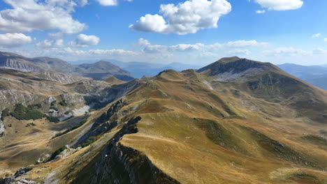 flight over beautiful mountain peaks covered with grass