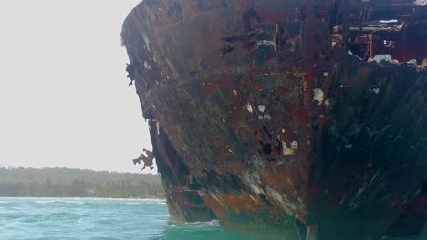 rusted shipwreck over caribbean sea in san andres island, colombia