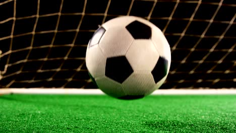 close-up of football bouncing on artificial grass 4k