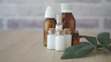 homeopathic remedies in small glass bottles