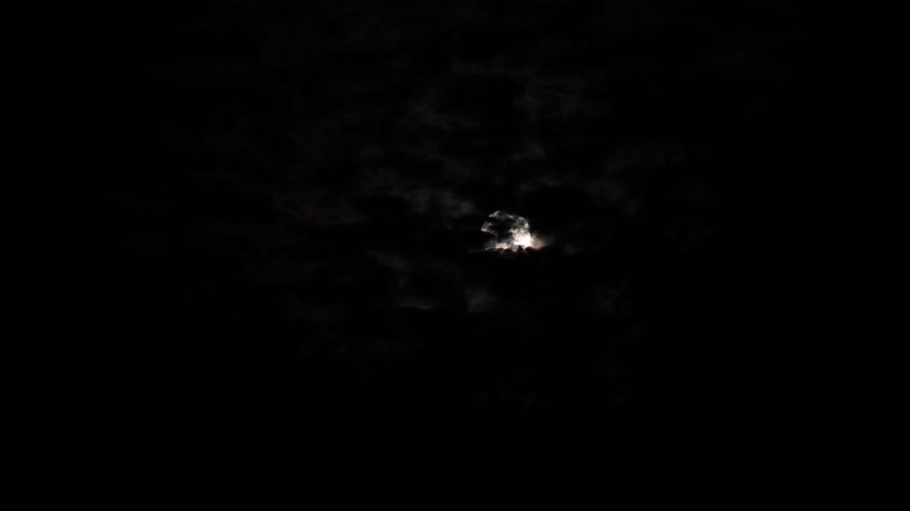 RIsing moon on a cloudy night