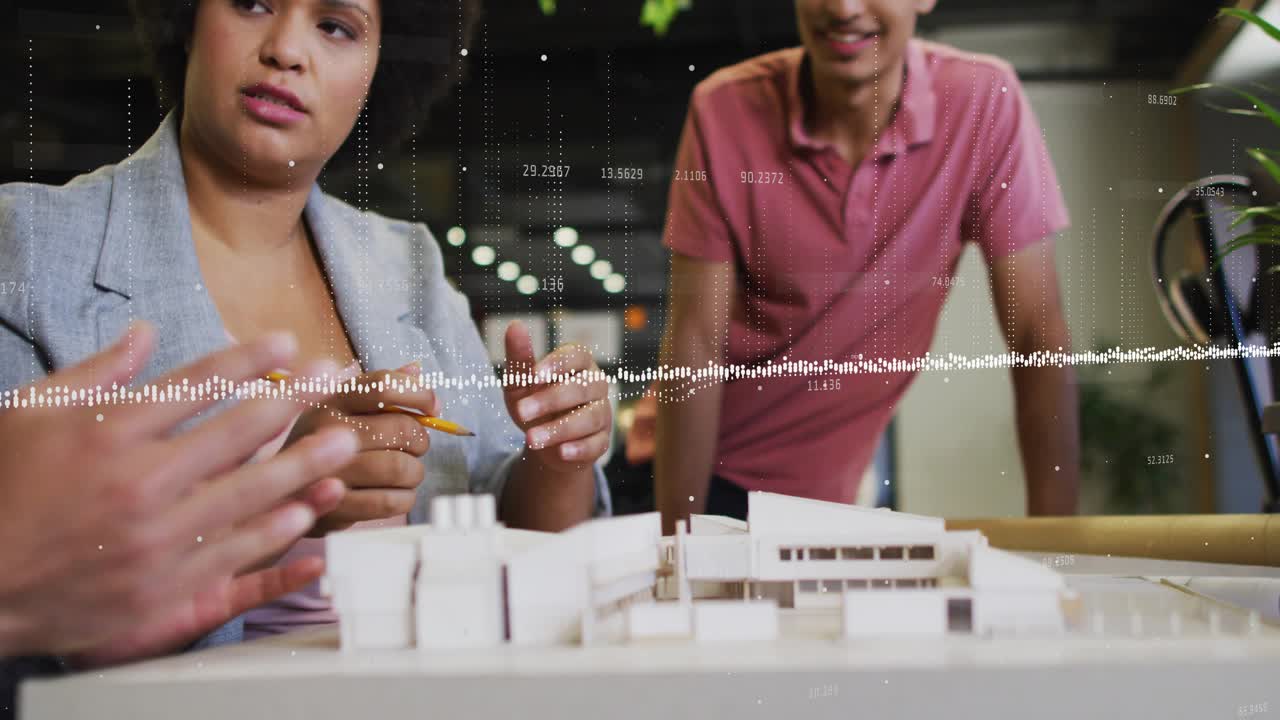 Design lead gesturing pencil urging team pointing at model to decide as animated tags appearing