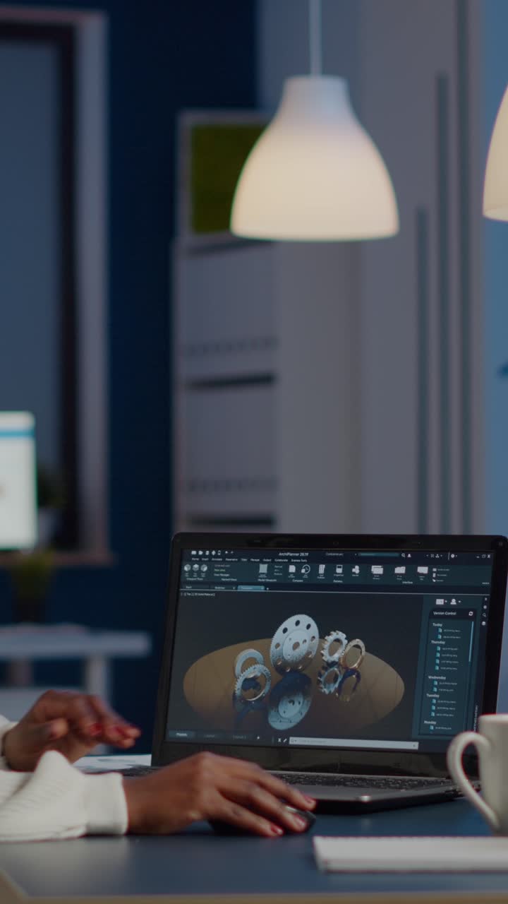 Vertical video African woman engineer working in modern cad program with gear