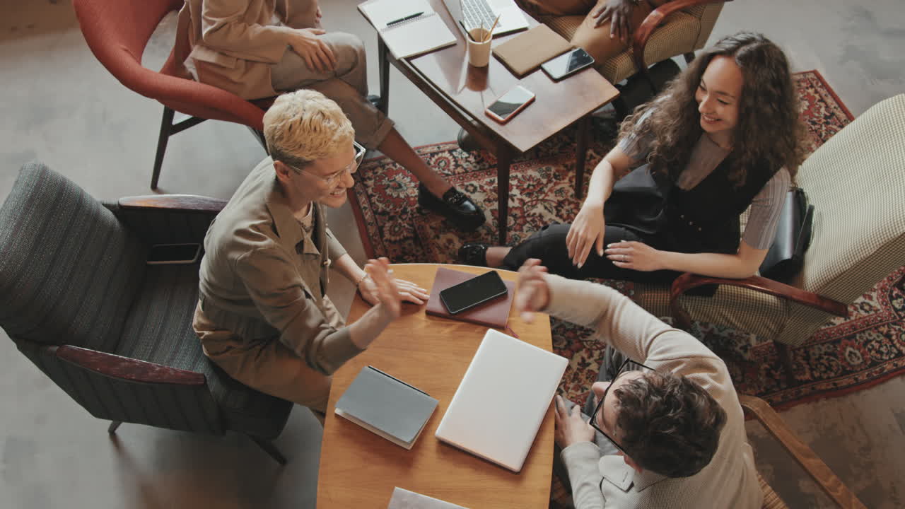 Top-View of Coworkers Giving High-Fives