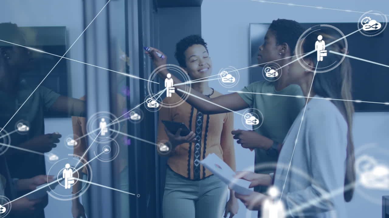 Animation of network of digital icons over three diverse women discussing over glass board at office