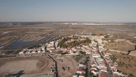 Aerial-view-of-Castro-Marim-salt-pans-and-Guadiana-River,-Algarve,-Portugal