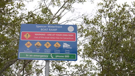 warning signage at spencer boat ramp on the hawkesbury river, nsw, australia