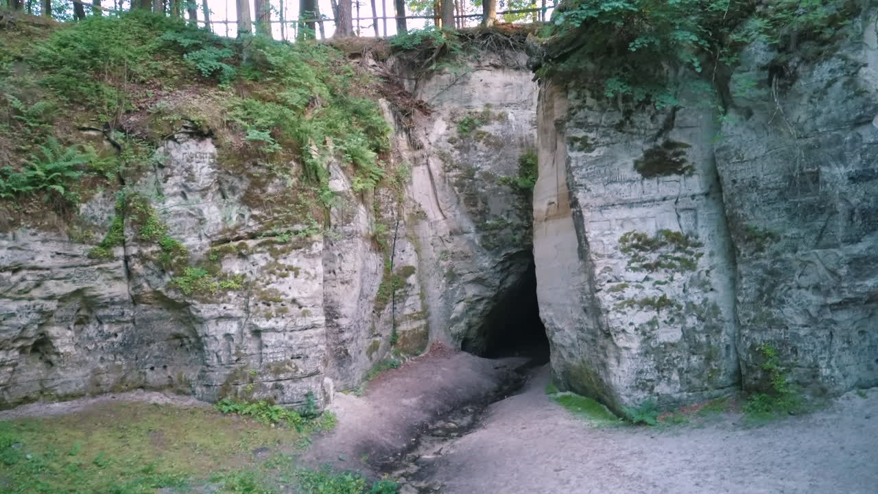 Cave in a Sandstone Cliff in a Forest