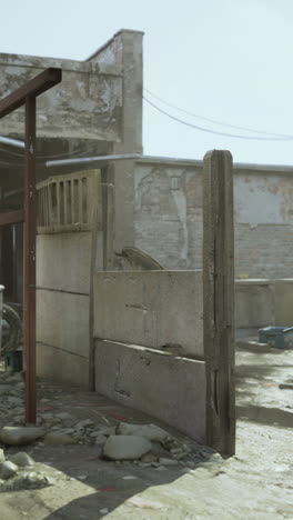 a close up of a broken concrete wall in an urban environment