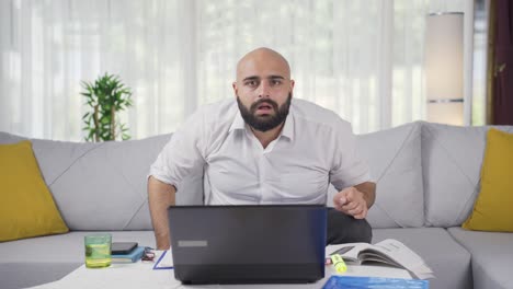 home office worker man looking at camera curious and confused.