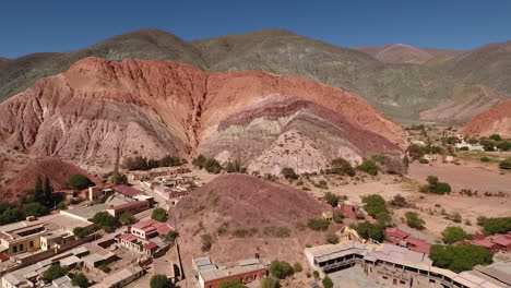 Aerial---Purmamarca,-Hill-of-Seven-Colors,-Argentina,-scenic-shot-backward