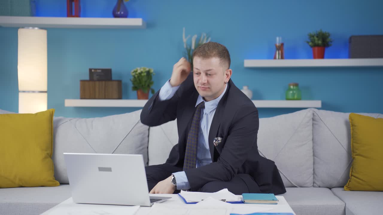 Home office worker man examining, analyzing documents.