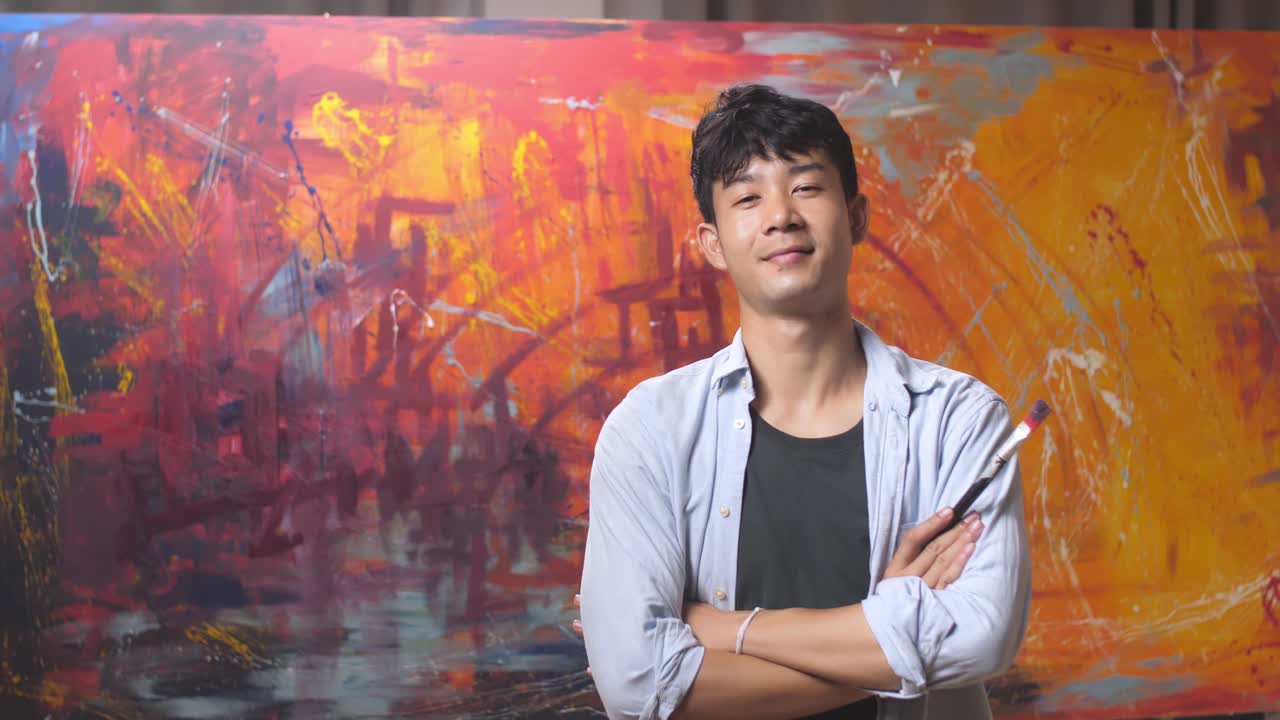 Asian Male Artist Works On Abstract Painting
