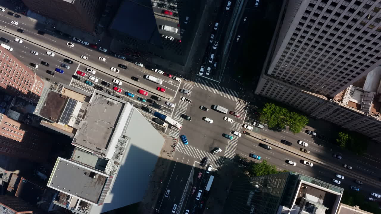 Aerial view of a busy city intersection with buildings and traffic