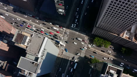 aerial view of a busy city intersection with buildings and traffic